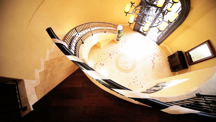 Young bride wedding dress full veil moving across luxury entrance hall