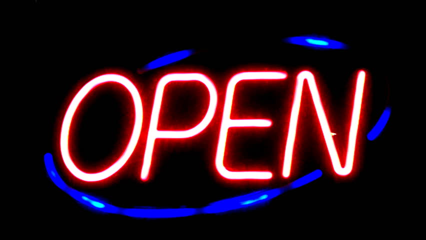 A fading neon "open" sign at night evokes the struggles of small businesses to stay open in a tough economy.