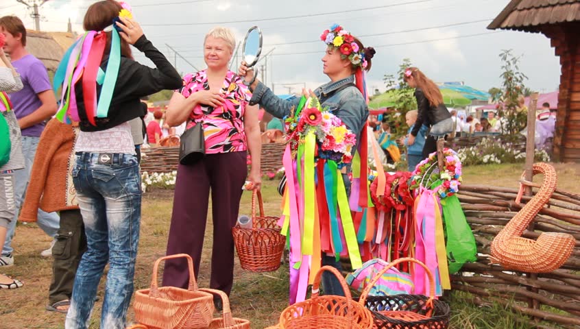 VELYKI SOROCHYNTSI, UKRAINE - AUGUST 17: People shop at the Sorochyntsy Fair on August 17, 2012 in Velyki Sorochyntsi, Ukraine. This large fair has been held every year since the end of Soviet rule and was declared Ukraine's national trade fair in 1999.