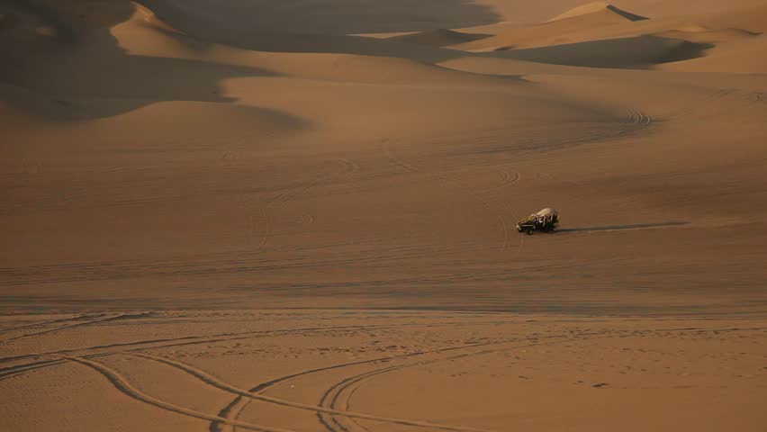 video footage of driving with a buggy off-road in the dunes of Ica, Peru