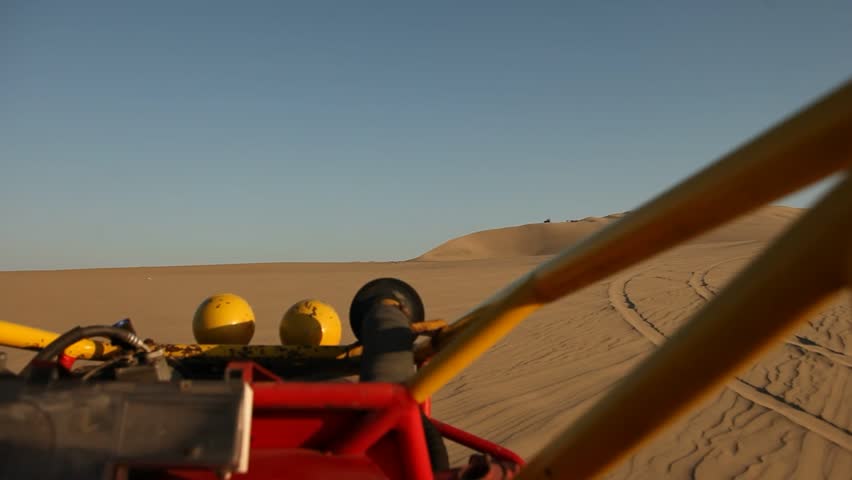 video footage of driving with a buggy off-road in the dunes of Ica, Peru