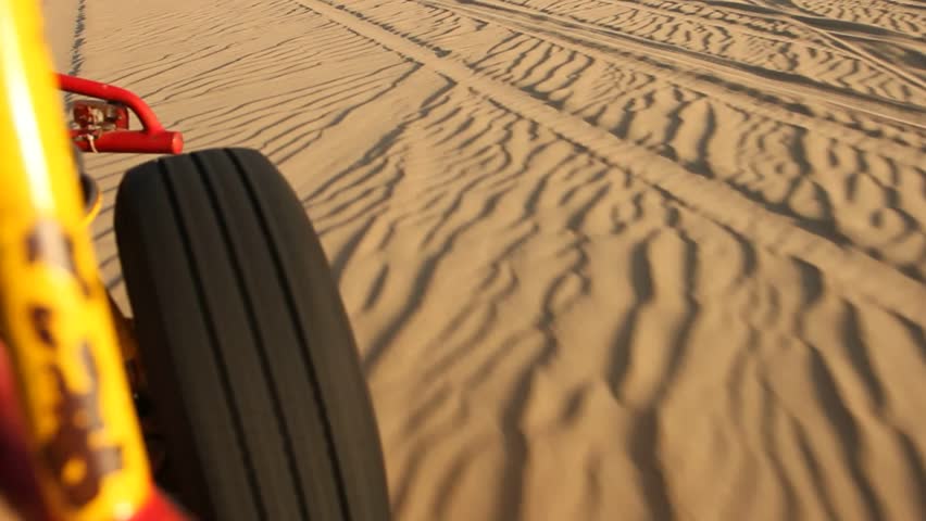 video footage of driving with a buggy off-road in the dunes of Ica, Peru