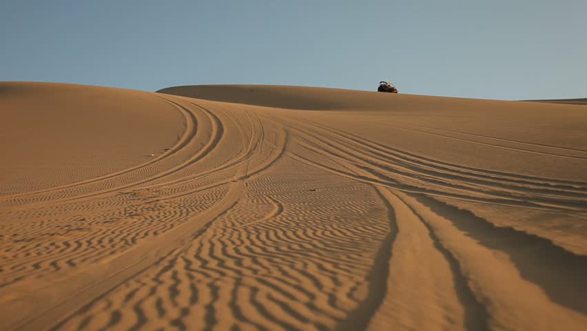 video footage of driving with a buggy off-road in the dunes of Ica, Peru