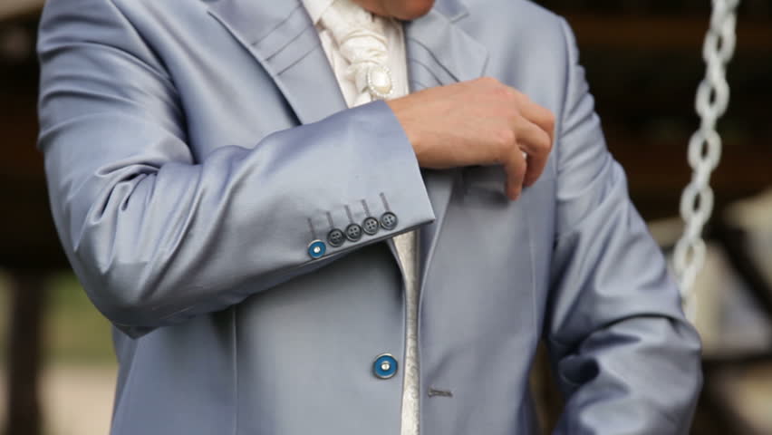 Groom in an extravagant suit waiting for the bride.
Groom in a suit.