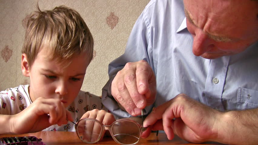 child with senior repair glasses 