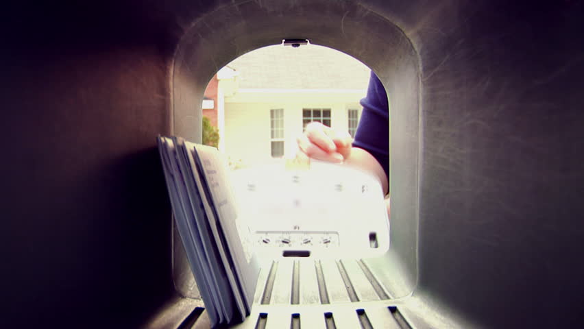 A POV shot of someone taking letters and mail out of the mailbox 1080 HD video