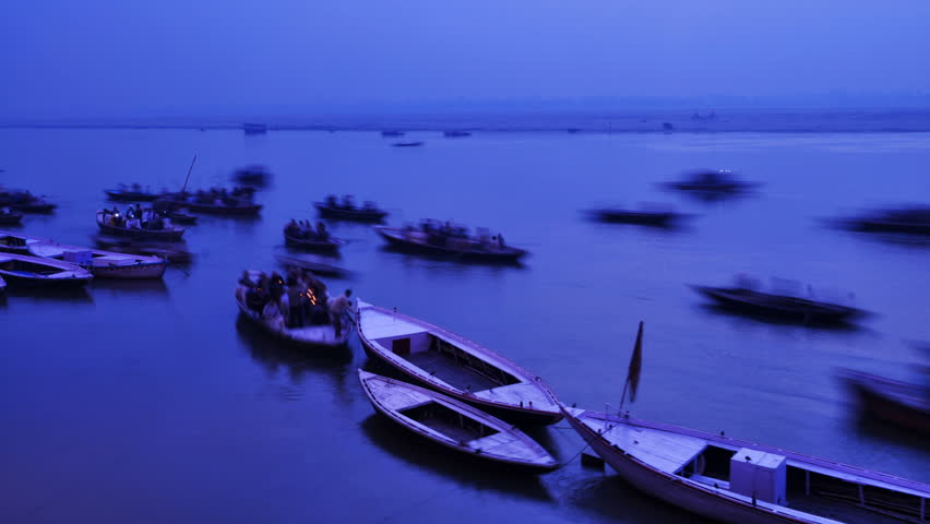INDIA - NOVEMBER 21: Indian pilgrims rowing boat in dawn, Ganges river on November 21, 2010 in Varanasi, India.