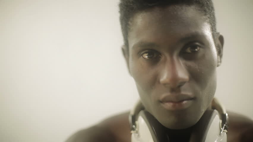 young african guy waving and dancing with a cool attitude