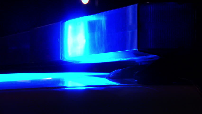 Blue police light bar on top of cruiser flashing at night 1080 HD video
