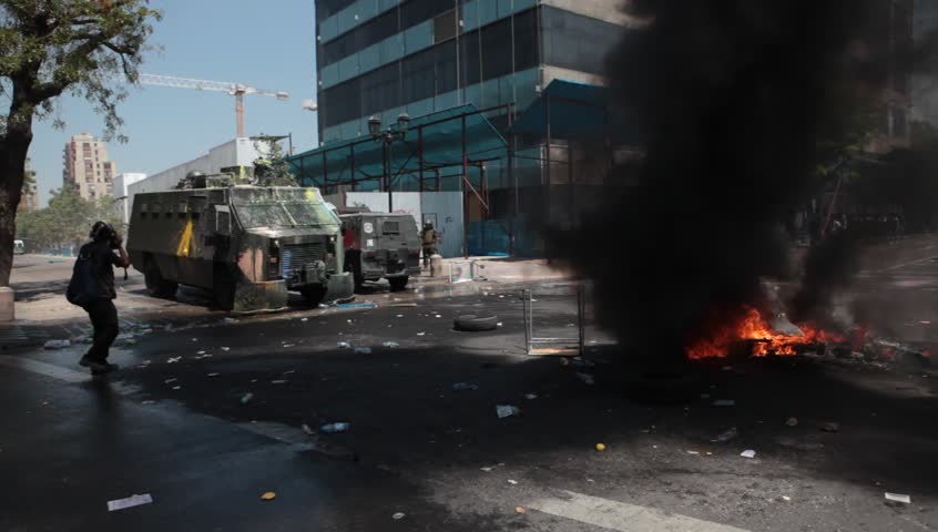 SANTIAGO, CHILE - OCTOBER 19: Chilean riot disperse protesters during a student strike on October 19, 2011 in Santiago, Chile. Protesters demand the government to improve education quality