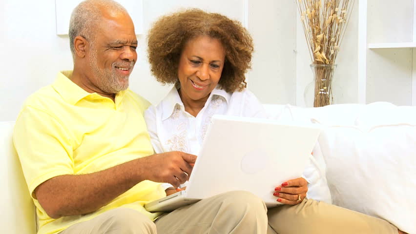 Senior African American couple laptop computer home