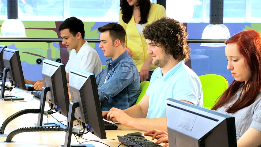 Brunette young lecturer examine class of diverse male and female classmates in college