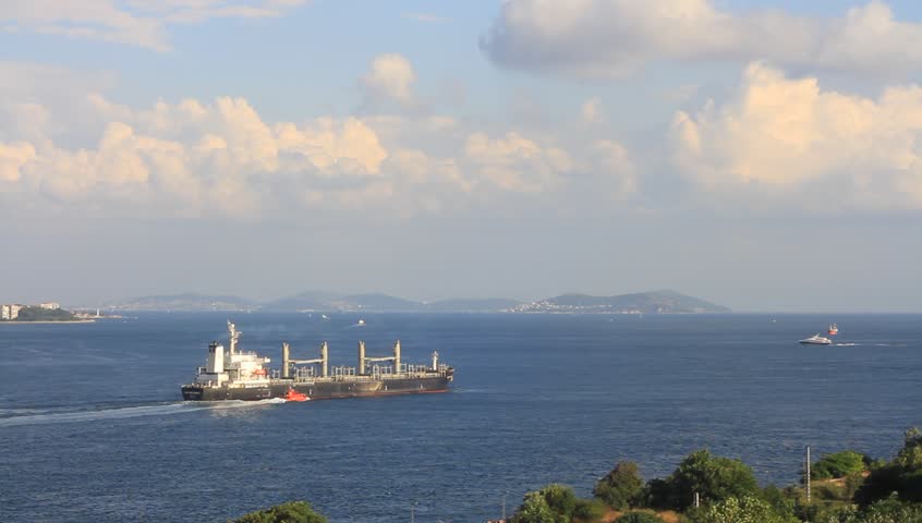 Cargo ship with a tug boat on route to Marmara Sea.
