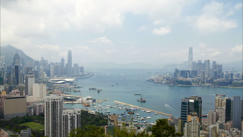 Hong Kong Harbor panorama cityscape - Central District, Victoria Harbor, Victoria Peak, Hong Kong Island and Kowloon, Hong Kong.