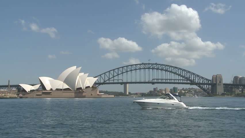 SYDNEY, AUSTRALIA, MAR 22, 2009: Sydney Opera House and Harbour Bridge at daytime with ships in the Harbor Bay Area