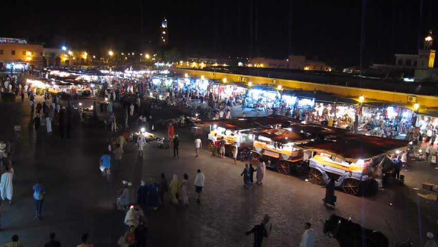 MARRAKECH, MOROCCO - CIRCA 2012: Jemaa el-Fnaa square. The imam, the community leader, makes the call to prayer at night during Ramadan, Marrakech, Morocco.