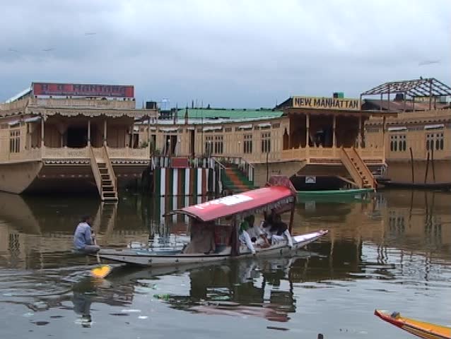Shikara boats and houseboats on Dal lake in Kashmir