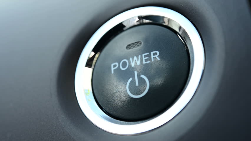 Pushing a power button in modern car 