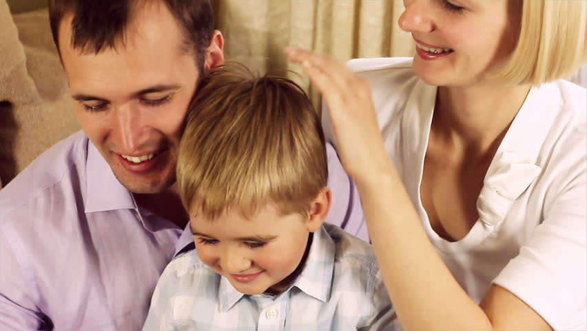Family with a tablet pc at home