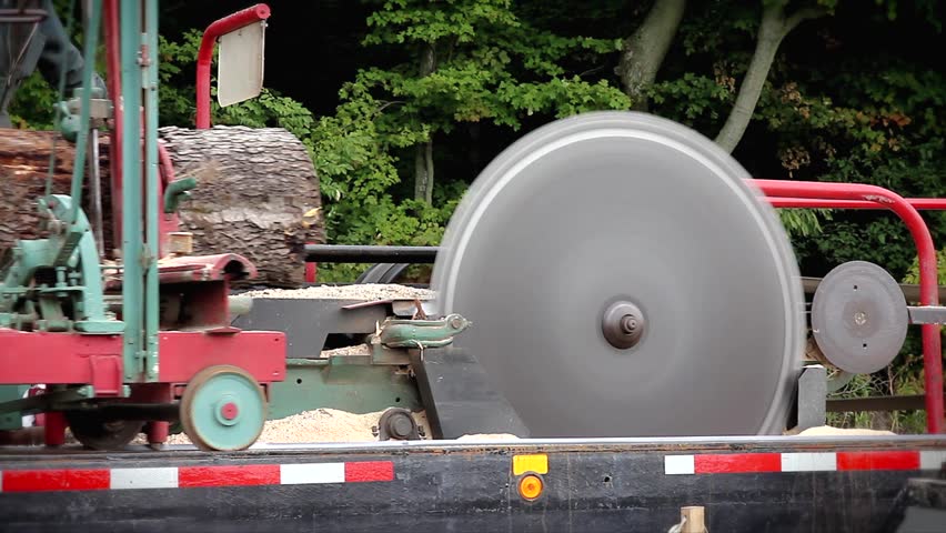 A 150-year-old pony saw mill saws a log into timber in Ontario, Canada.