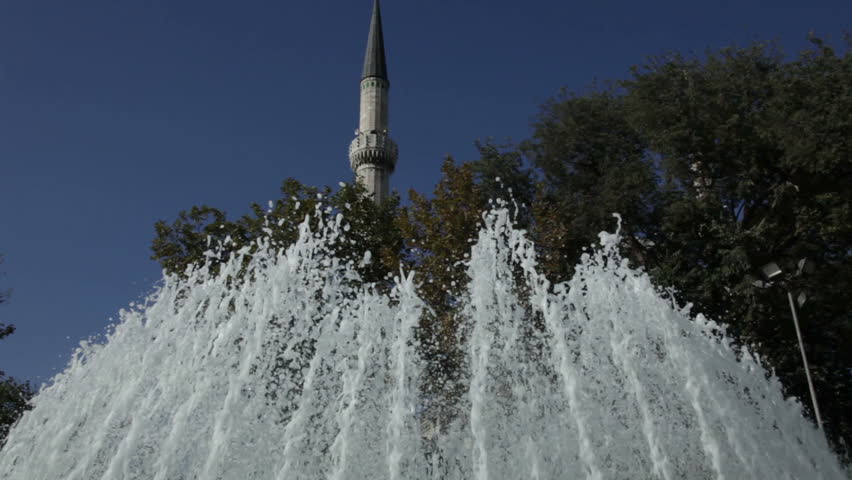 fountain and minaret of a mosque