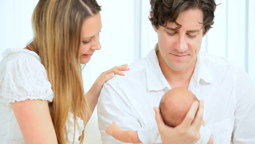 Proud young Caucasian parents with their new baby