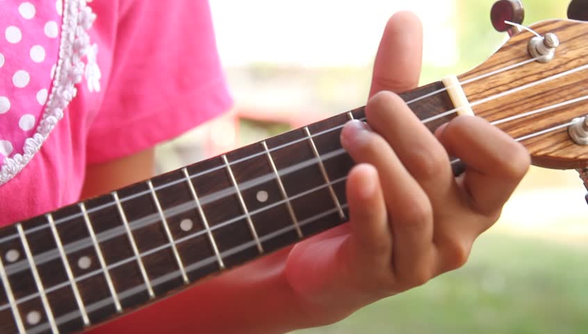 playing ukulele soft focus