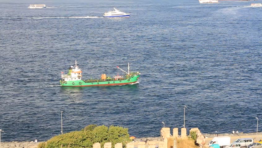 Green cargo ship sailing into Marmara Sea
