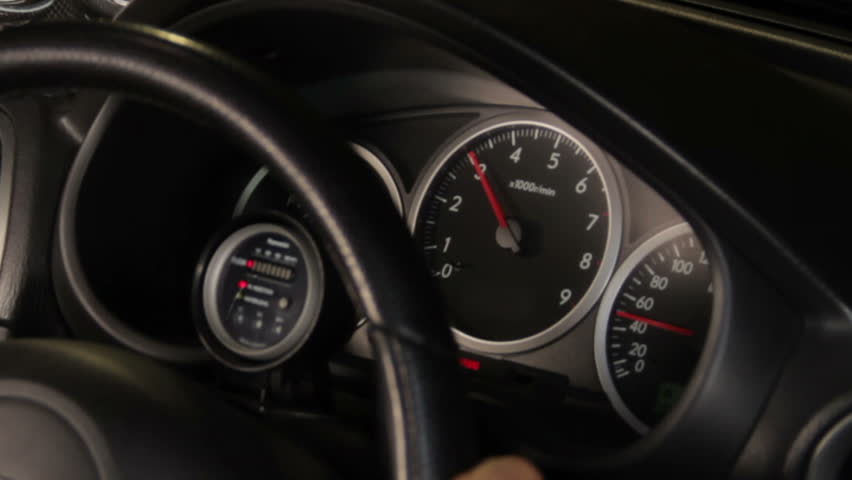 a sports car instrument panel, showing rpm and high speed acceleration with turbo sound