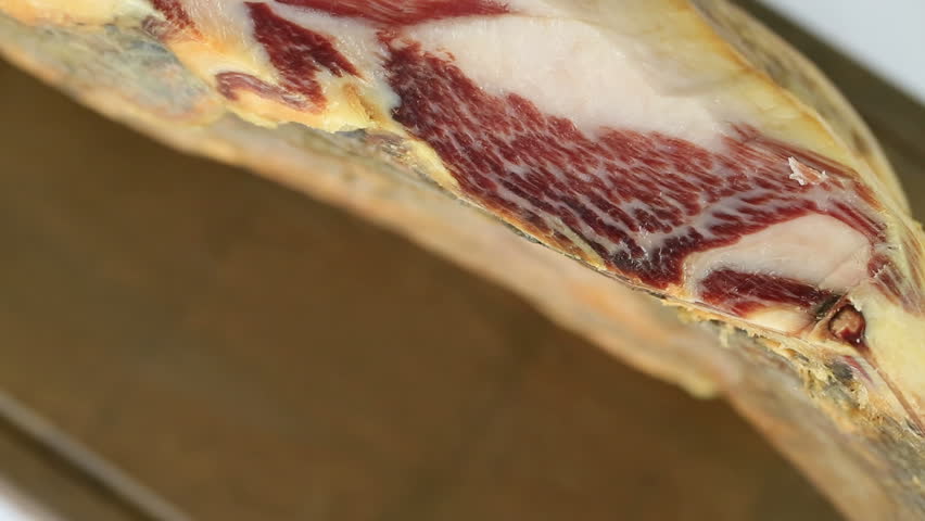 Cutting serrano ham slices