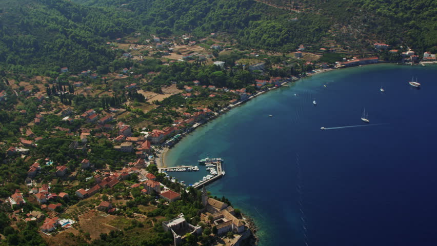 Helicopter aerial shoot of a village with hotels and monastery on island Lopud - a tourist destination in Dubrovnik archipelago, Croatia