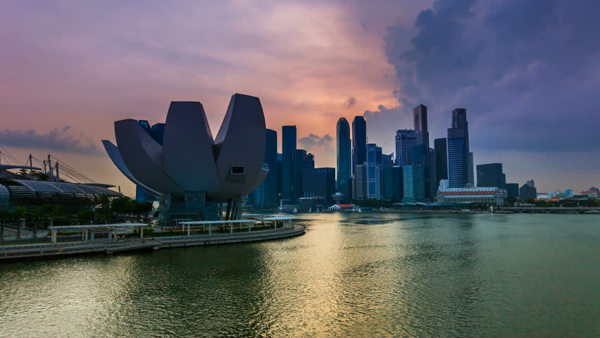 SINGAPORE - 12 OCTOBER 2012: Timelapse view of Singapore skyline at sunset from Marina Bay