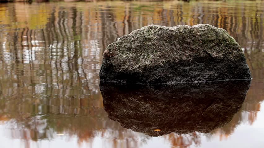 boulder in the water