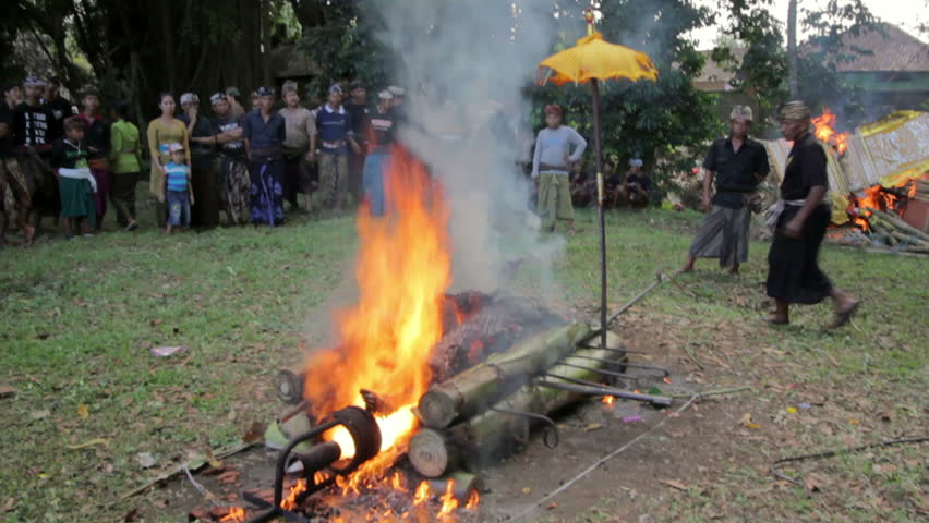 BALI - MAY 2012: burning dead body in Balinese funeral, religious ceremony