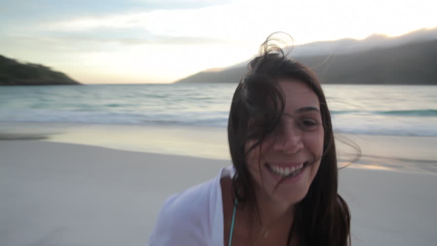 Woman walking and playing on the beach