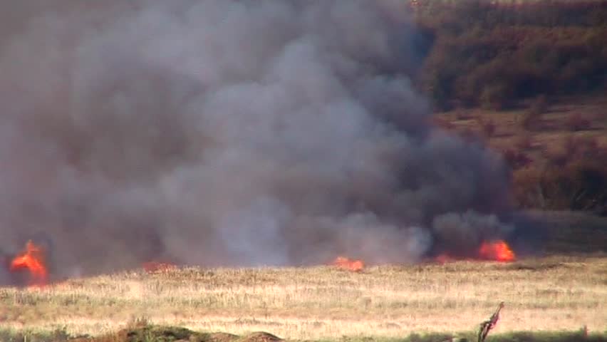 A grassfire burns out of control