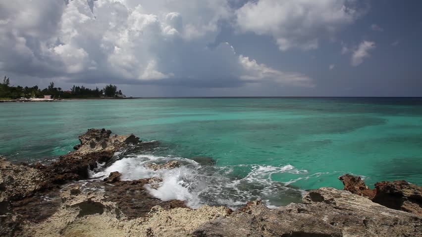 Gentle Caribbean sea waves touching rocks, Grand Cayman. Ambient sound.