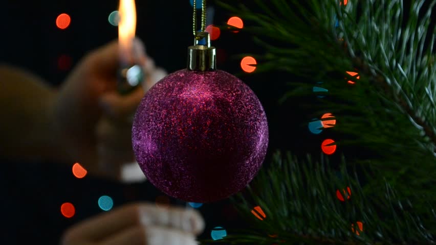 Christmas toy on a background of flashing light bulbs