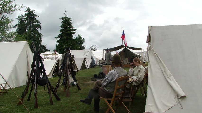 PORT GAMBLE, WA - JUN 20 -  	Confederate camp is quiet,as sutler and his wife relax  before 		 a mock battle at Port Gamble WA on Jun 20, 2009.

