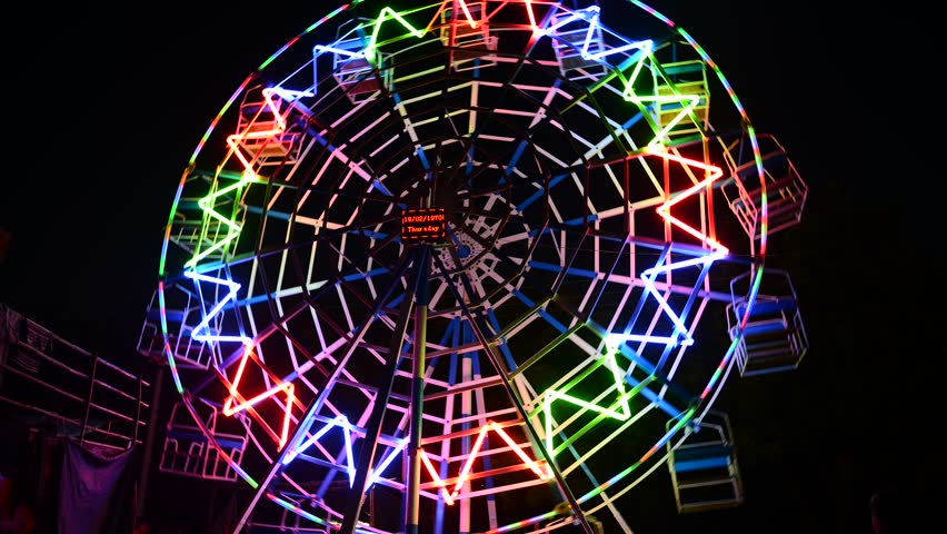 BAGAN, MYANMAR - OCTOBER 20: Time lapse of man-powered ferris wheel during âfestival of lightsâ, at Aye Nyein Tharyar Park, Bagan on October 20, 2012 in Bagan, Myanmar