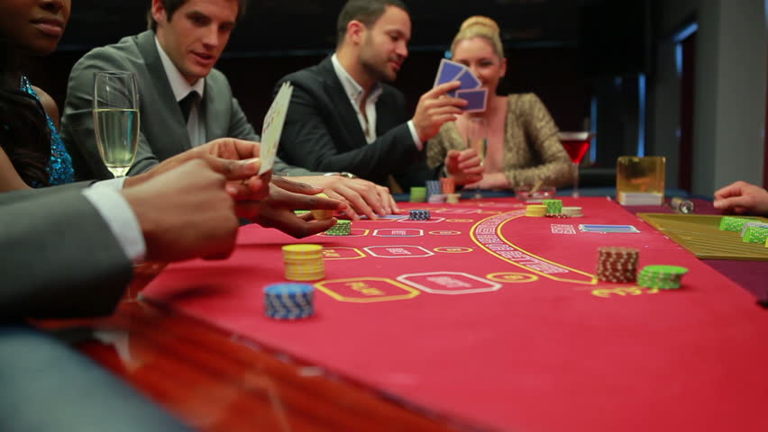 Bets being placed at poker game in casino