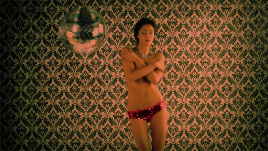 sensual shot of a beautiful woman dancing, covering her body with her hands