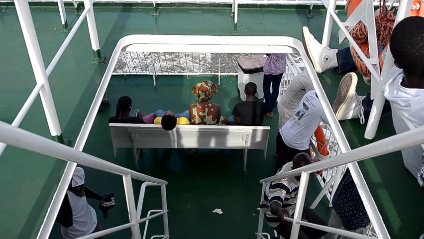 ZIGUINCHOR, SENEGAL - SEPTEMBER 29: Passengers aboard the new ferry between Ziguinchor and Dakar on September, 29 2012 in Ziguinchor, Senegal. The old ship sank in 2002, killing at least 1,863 people.