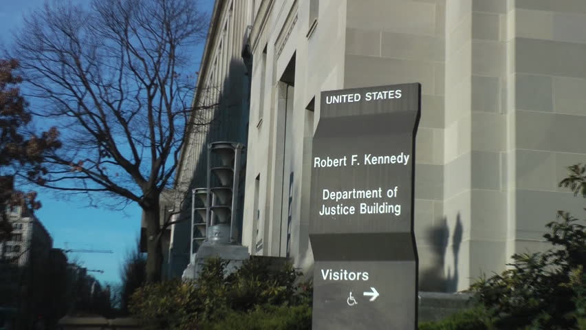 U.S. Justice Department, zoom in on sign, headquarters in Washington, DC.  Renamed the Robert F. Kennedy Department of Justice Building in 2001, Constitution Ave. side.