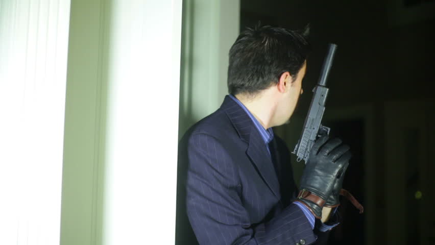 A secret agent with a silencer gun