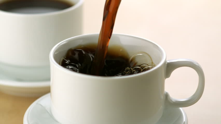 Pouring milk into coffee shooting with high speed camera.