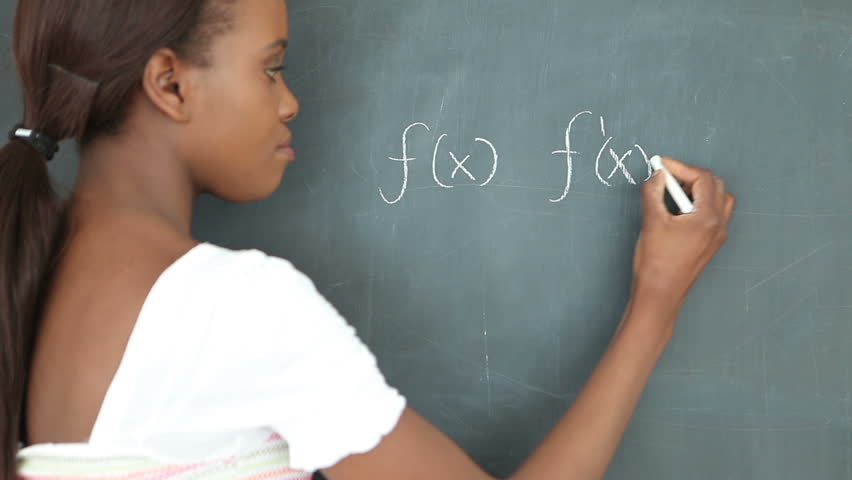 Video of a student writing on a blackboard in a classroom