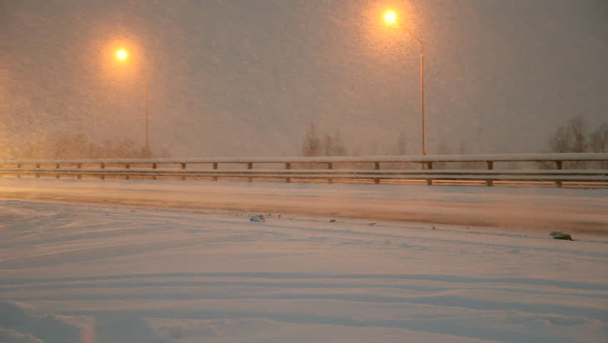 Winter highway. Snow, blizzard, cars