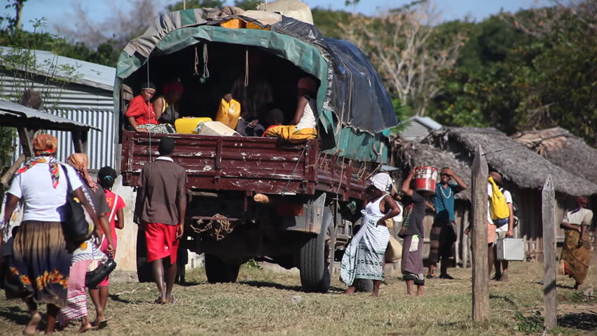MADAGASCAR - JULY 2012. Malagasy villagers meet weekly transport truck. Funding shortfalls jeopardise World Food Programme's relief supplies deployed to cyclone-vulnerable areas in Madagascar.