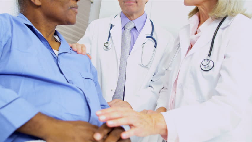 Medical Consultants Reassuring Patient